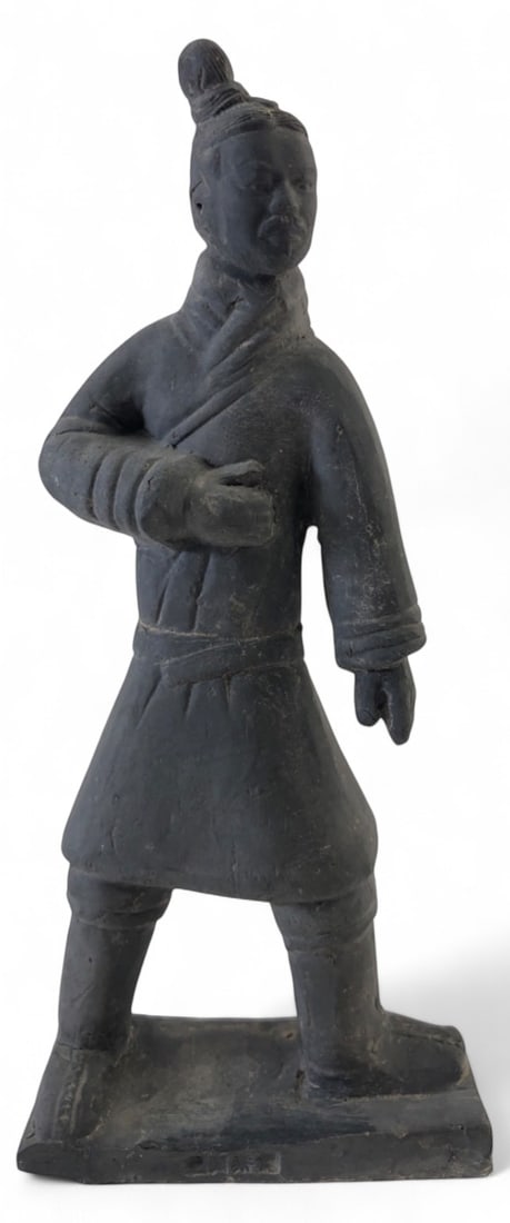 Chinese Terracotta Warrior Replica Figure 8" H: Chinese Terracotta Army warrior replica figure. Constructed of dark grey clay or composite material. Features a standing soldier in traditional tunic with a topknot hairstyle. Faint impressed