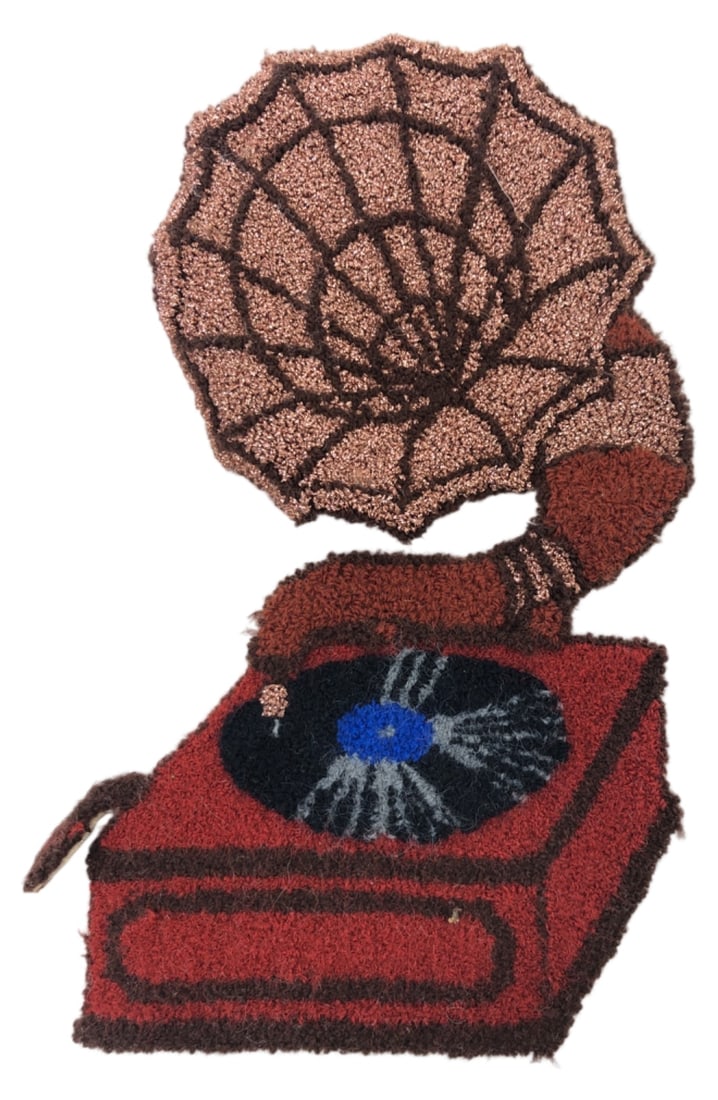 VTG Punch Needle Gramophone Applique Patch: Vintage punch needle textile applique shaped like a classic gramophone. Unmarked maker. Constructed with textured yarn in shades of brown, red, and black, featuring metallic thread accents on the