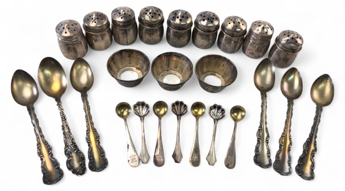 Sterling Silver Miniature Tableware Lot: Lot of sterling silver miniature tableware including 9 shakers, 3 salt cellars, and 13 total small spoons. Some spoons feature shell bowls and monograms. Pieces are stamped "STERLING", with some