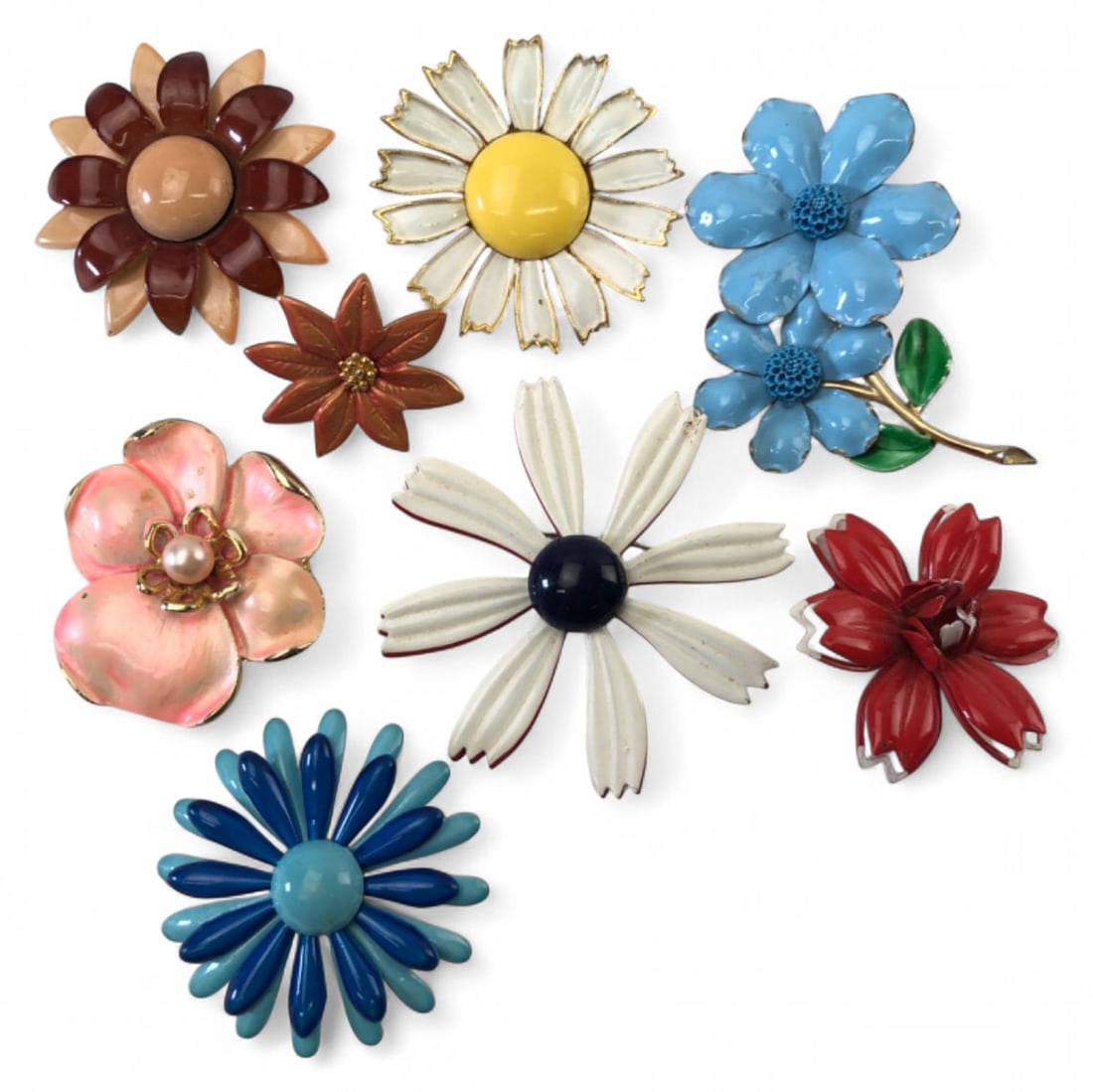 VTG Kramer & Enamel Flower Pin Lot: Lot of 8 vintage enamel flower brooches in various colors and styles. Includes one pin marked Kramer. Features gold-tone and silver-tone metal settings, some with faux pearl or textured centers. Shows