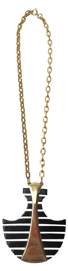 Geometric Black & Gold Tone Pendant Necklace: Unmarked geometric pendant necklace featuring a striking Mid-Century Modern style design. Constructed with a flared gold-tone metal center flanked by horizontal black plastic or acrylic slats.