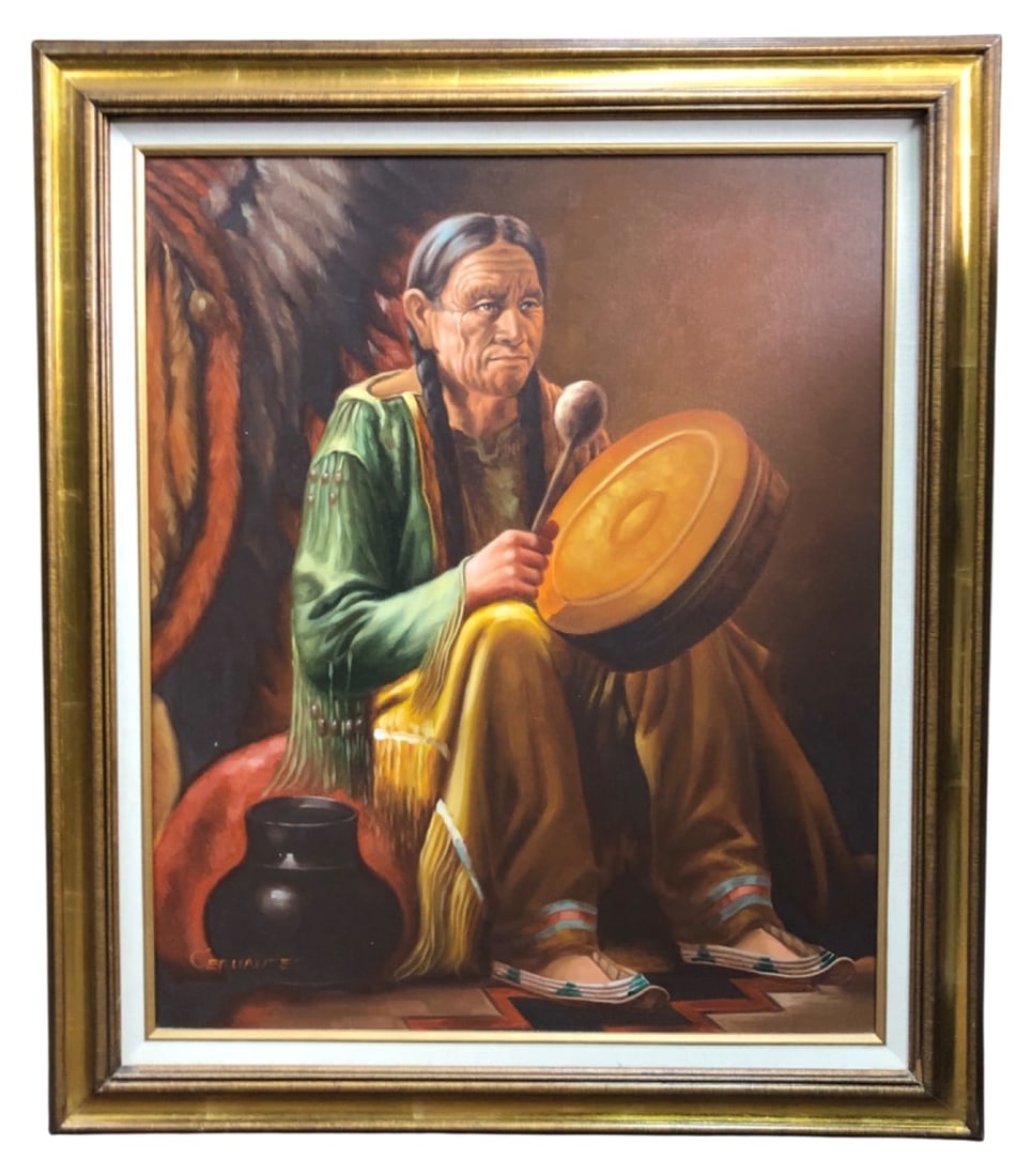 Ceruantes Signed Native American Oil Painting: Framed oil on canvas painting depicting a Native American man with a drum, signed "CERUANTES" in the lower left corner. The back features a gold foil sticker reading "ARTISTIC IMPRESSIONS INC. 506772 