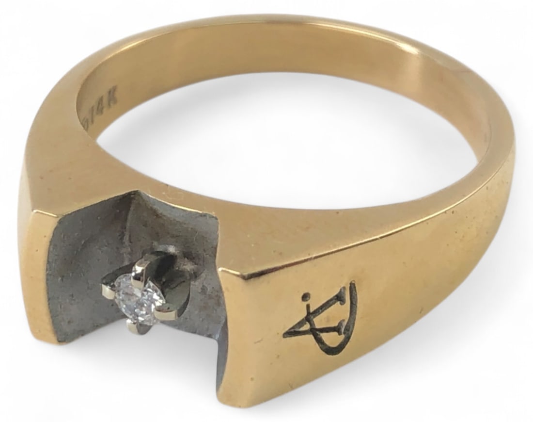 14K Yellow Gold Diamond Ring Size 8: 14K yellow gold ring featuring a small round cut diamond in a tension-style setting. Diamond not verified. Features an engraved 'A' logo on the exterior band, likely a corporate service award ring. Th