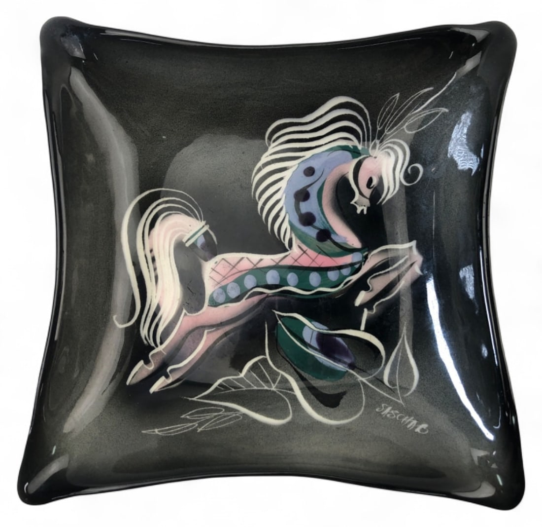 MCM Sascha Brastoff Glass Star Steed Tray: Mid-Century Modern square glass tray by Sascha Brastoff, featuring a stylized Star Steed horse motif in pink, blue, and white over a black ground. Signed SASCHA B on the front. The dish has gently upt