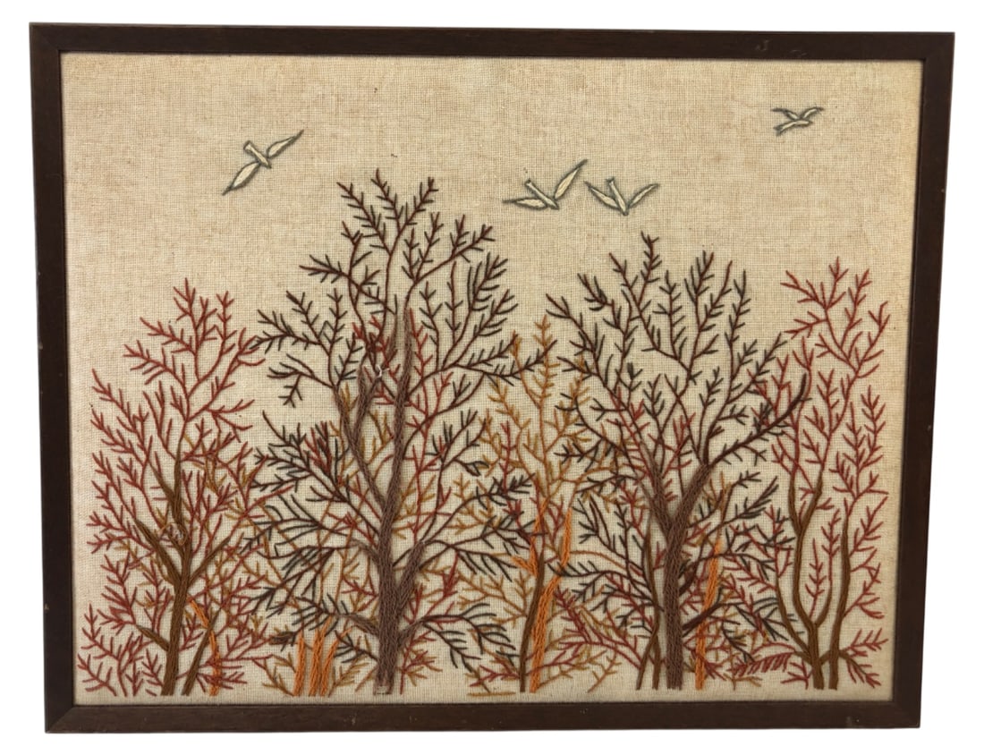 VTG Crewel Embroidery Winter Trees & Birds Art: Vintage framed crewel embroidery wall art depicting a winter landscape with bare trees and flying birds. Unsigned. Worked in wool yarn on a linen-type ground. Housed in a simple wood frame. Condition: