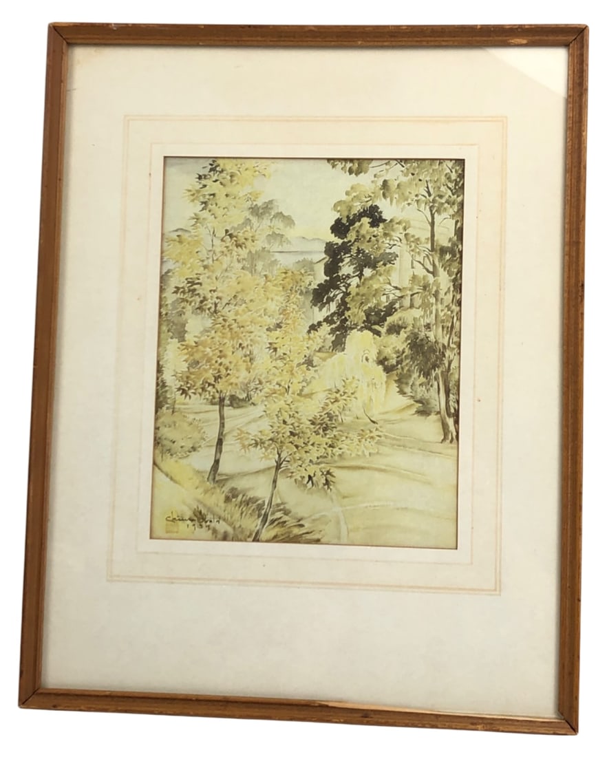 Chiura Obata 1939 Landscape Print: Framed landscape print by Chiura Obata, originally dated 1939. Features a serene scene of trees and a path with distant hills. Signed "Chiura Obata 1939" with a red seal mark in the plate. Housed in