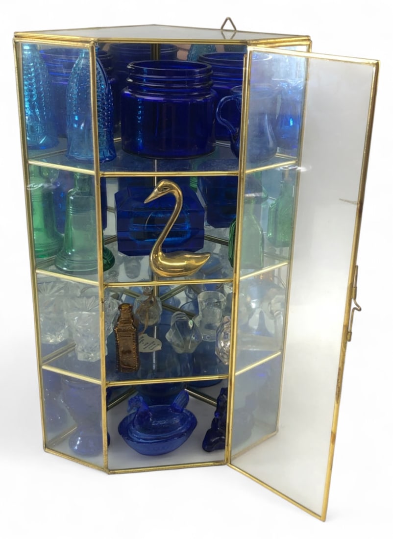 VTG Brass & Glass Corner Cabinet w/ Miniatures: Vintage brass and glass mirrored corner display cabinet containing a collection of assorted glass and brass miniatures. Includes blue, green, clear, and amber glass bottles, animals, and vessels, plus