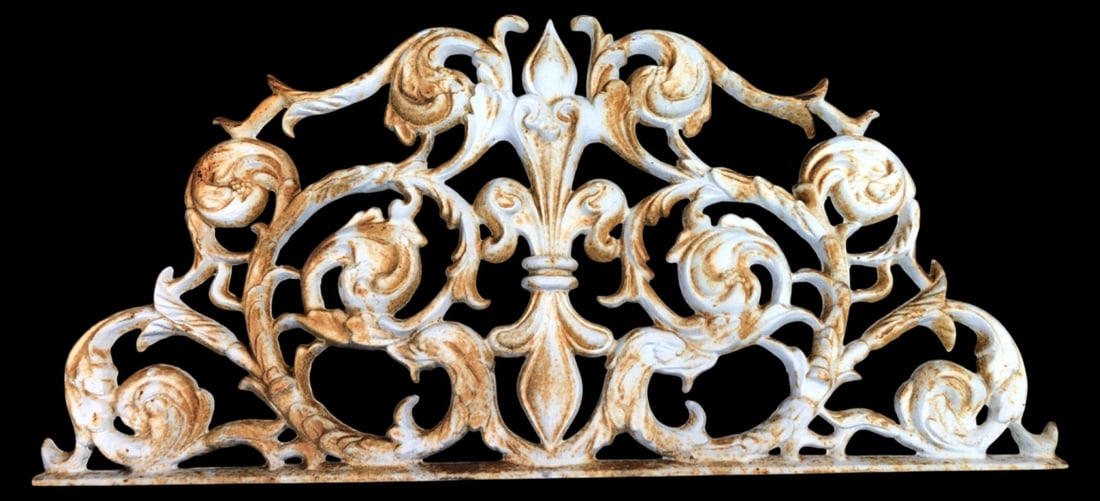 Cast Iron Architectural Scrollwork Topper, 24.5" W: Cast iron architectural scrollwork topper featuring a central fleur-de-lis motif and ornate scrolling foliage. Measures 24.5" W. Item shows rust and paint loss throughout.