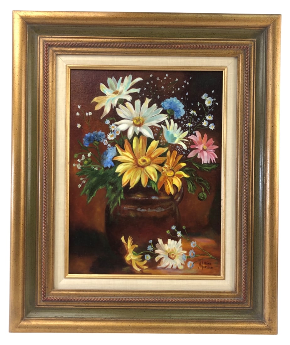 Marion Marzion Floral Still Life Oil Painting: Framed oil on canvas floral still life painting by Marion Marzion. Features a vibrant bouquet of daisies and cornflowers in a brown jug against a dark background. Signed "MARION MARZION" in the lower