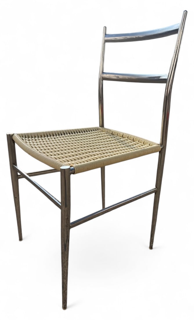 MCM Attributed to Gio Ponti Chrome Woven Chair: Mid-Century Modern side chair attributed to Gio Ponti. Features a tubular chrome frame with tapered legs and a woven seat. Measures 32.25" H x 16.25" W x 18" D with an 18" seat height. Condition: