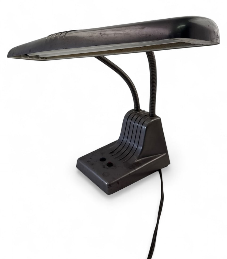Dazor Model 1000 Dual Gooseneck Desk Lamp: Dazor Mfg. Corp. Model 1000 dual gooseneck desk lamp. Features a grey metal finish, stepped Art Deco style base, and wide shade housing two fluorescent tubes. Marked with maker details and Saginaw