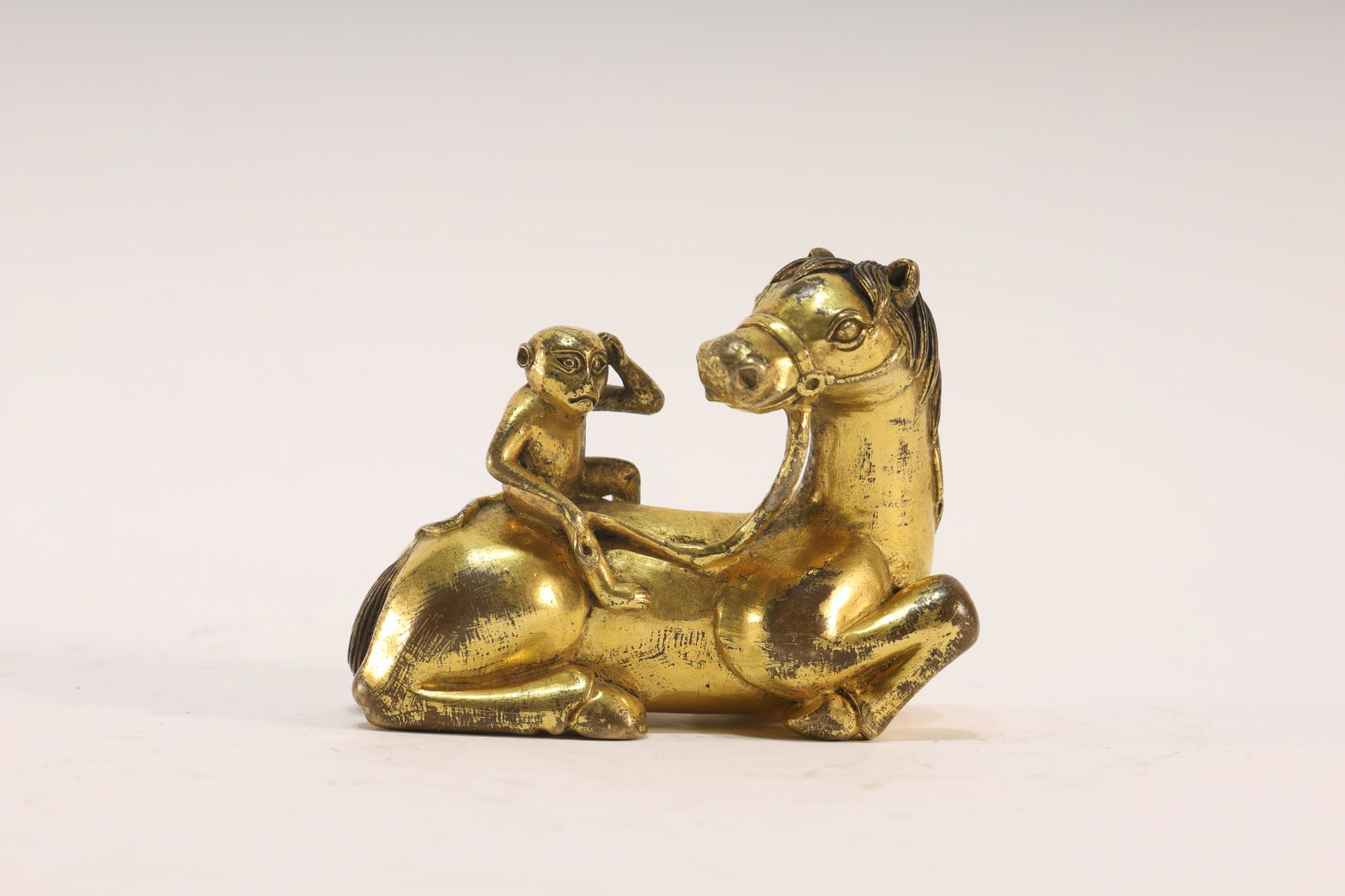 A Gilt Bronze Statue of Monkey Horseâ€™: A Delicate Gilt Bronze Tibetan Statue of Monkey Riding a Horse Chinese Qing Dynasty 17-18th Century Size: 7.5x3x5.5cm