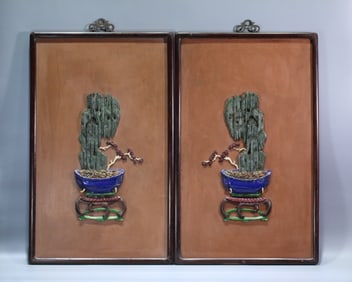 A pair of old mahogany hanging screens