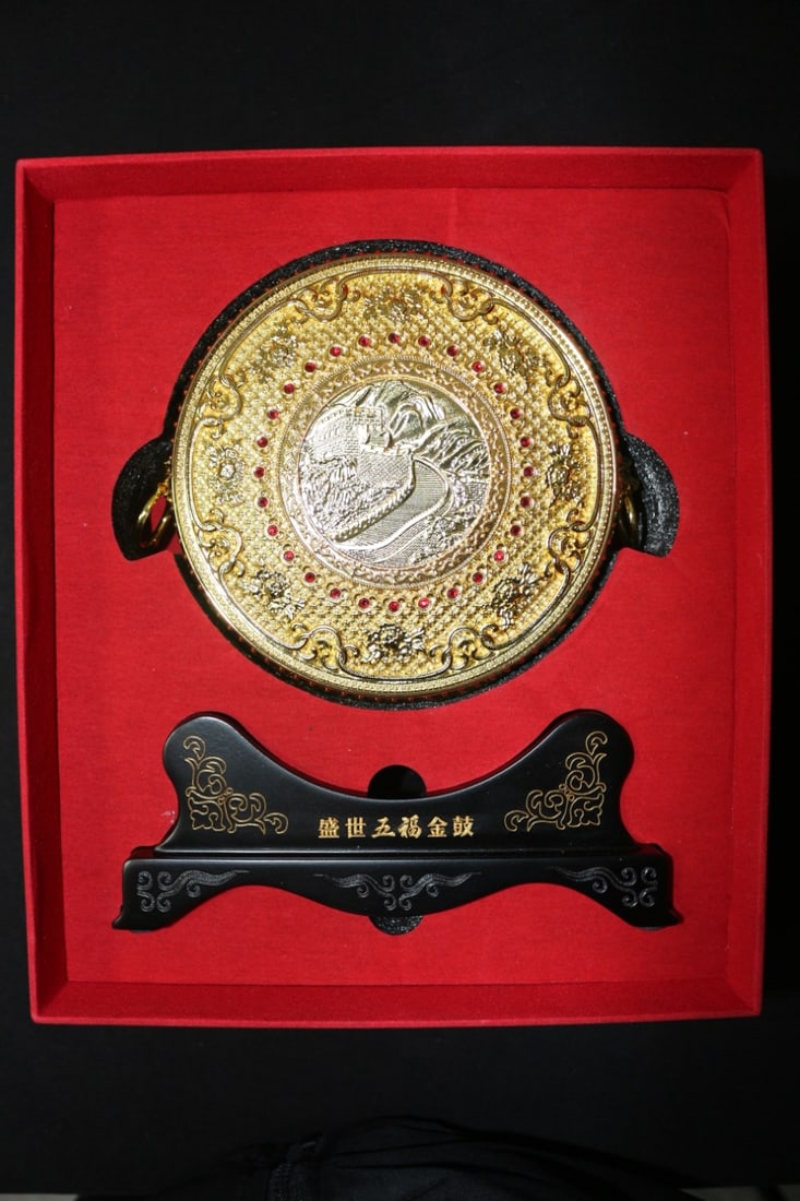 Golden drum: Length 13.5cm, height 6cm