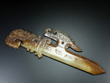 A Hetian jade weapon-shaped device