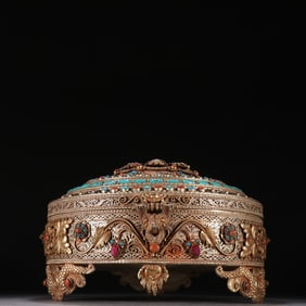 Gilded bronze filigree box inlaid with gemstones