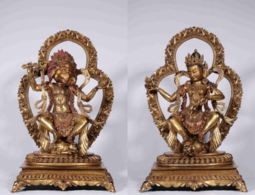 A pair of gilded bronze gods of wealth