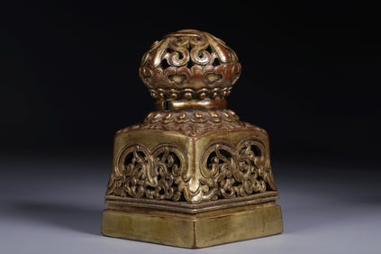 Gilded copper seal with scroll pattern