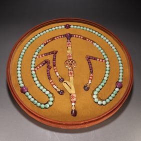 A PLATE OF JADEITE IMPERIAL BEAD