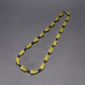 TOPAZ KNEELING MAN NECKLACE