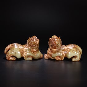 A PAIR HETIAN JADE LION PENDANT