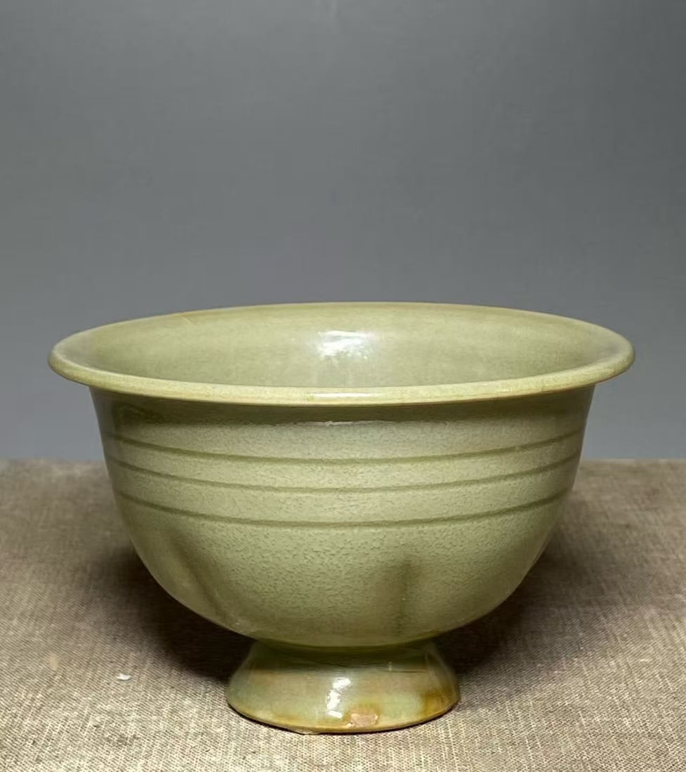 N Song 11th C Longquan Celadon Bird Stem Bowl: Northern Song Dynasty (960–1127), 11th century, A Longquan ware celadon-glazed stem bowl with applied bird decoration, delicately modeled./ Mouth Diameter 10 cm / Height 6.5 cm/AI Authentication: At