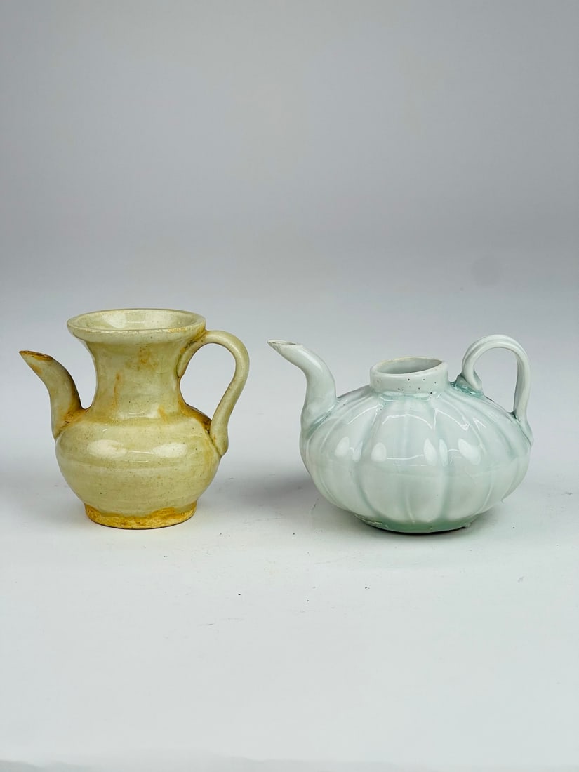 Song Dynasty (12th–13th C) Qingbai Ewers, Pair: A group of two Qingbai-glazed ewers, Song dynasty, each finely potted with small and elegant forms, covered in a smooth and lustrous glaze. The shapes are delicate and refined, typical of Song dynasty