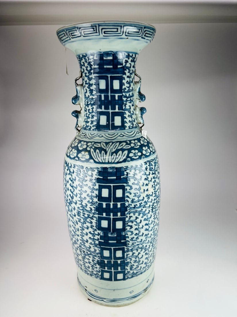Qing (19th C) Blue and White Double-Handle Vase: A large blue-and-white vase with double chilong handles and “double happiness” character decoration, Qing dynasty, 19th century, sturdily potted with a thick and substantial body and an elegan
