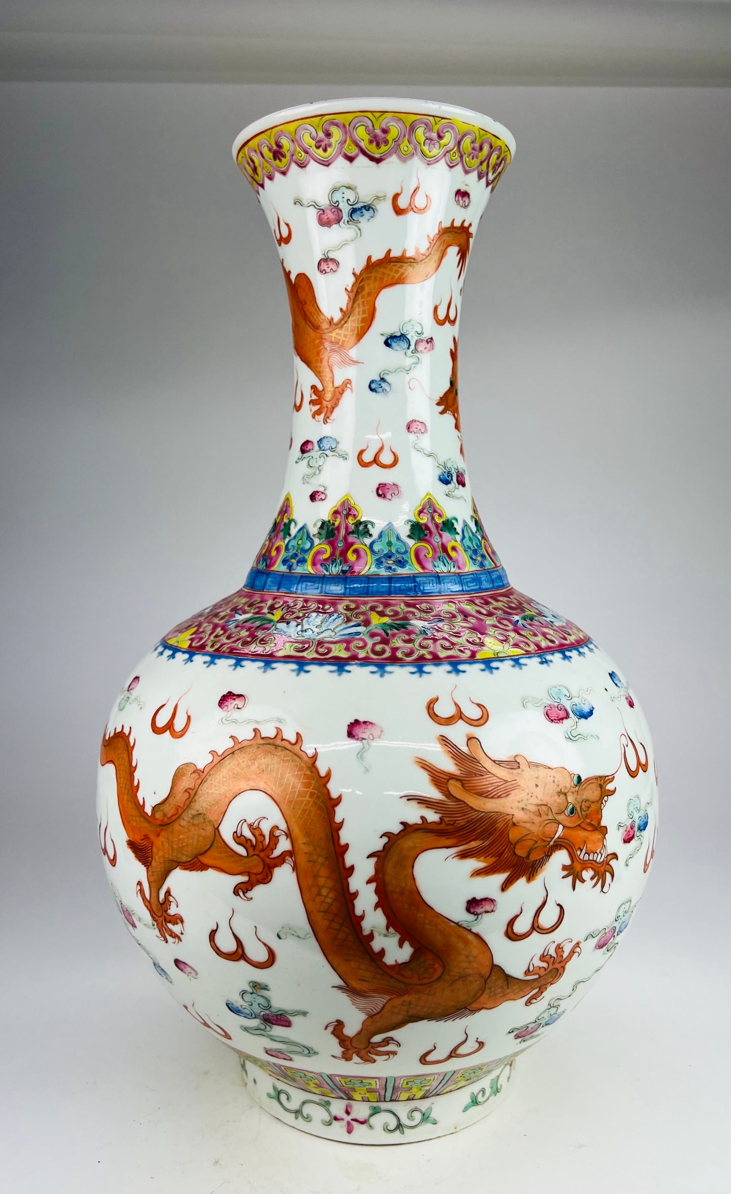 Qing Guangxu (19th C) Famille-Rose Dragon and Phoenix Vase: A famille-rose vase with dragon and phoenix decoration, Jingdezhen kiln, Qing dynasty, late period (Guangxu–Xuantong), elegantly potted with a sturdy and well-proportioned body. The surface is decor