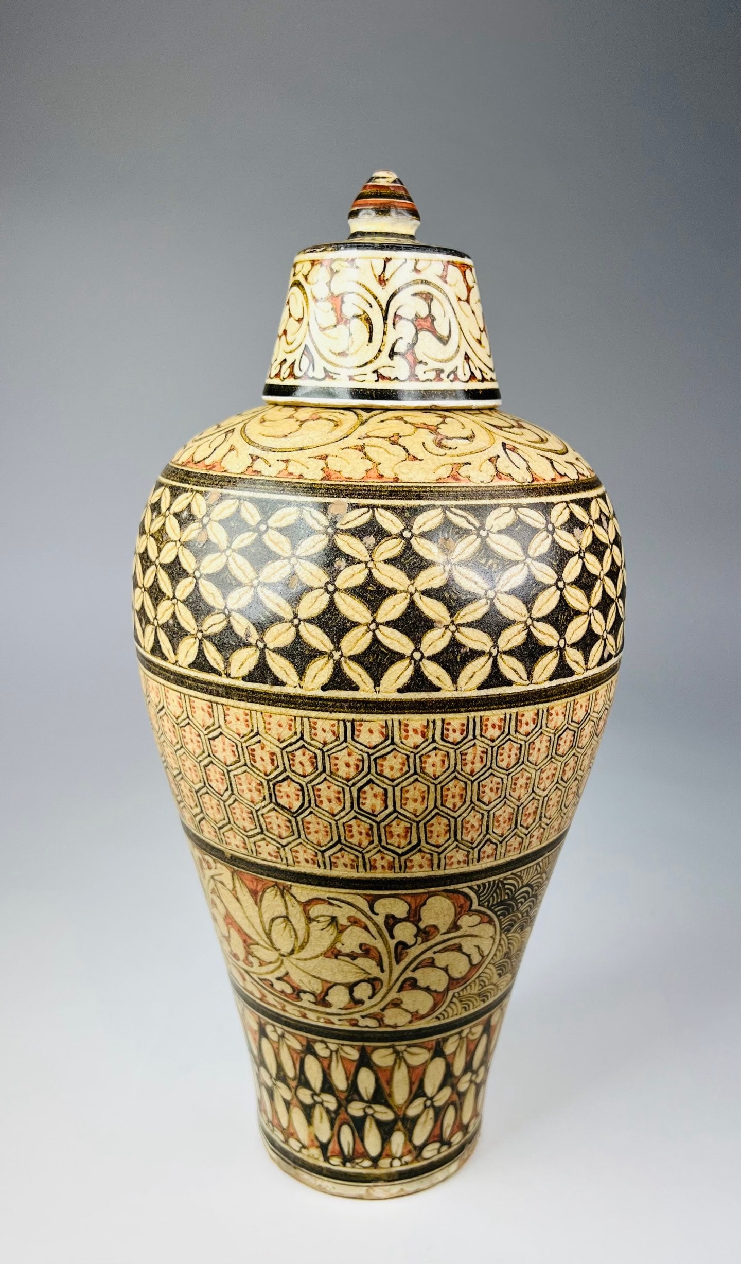 Northern Song (11th C) Cizhou Kiln Painted Meiping: A yellow-ground painted floral covered meiping vase, Cizhou kiln, Northern Song dynasty, of well-proportioned and elegant form. The body is richly decorated with multiple bands of painted motifs, crea
