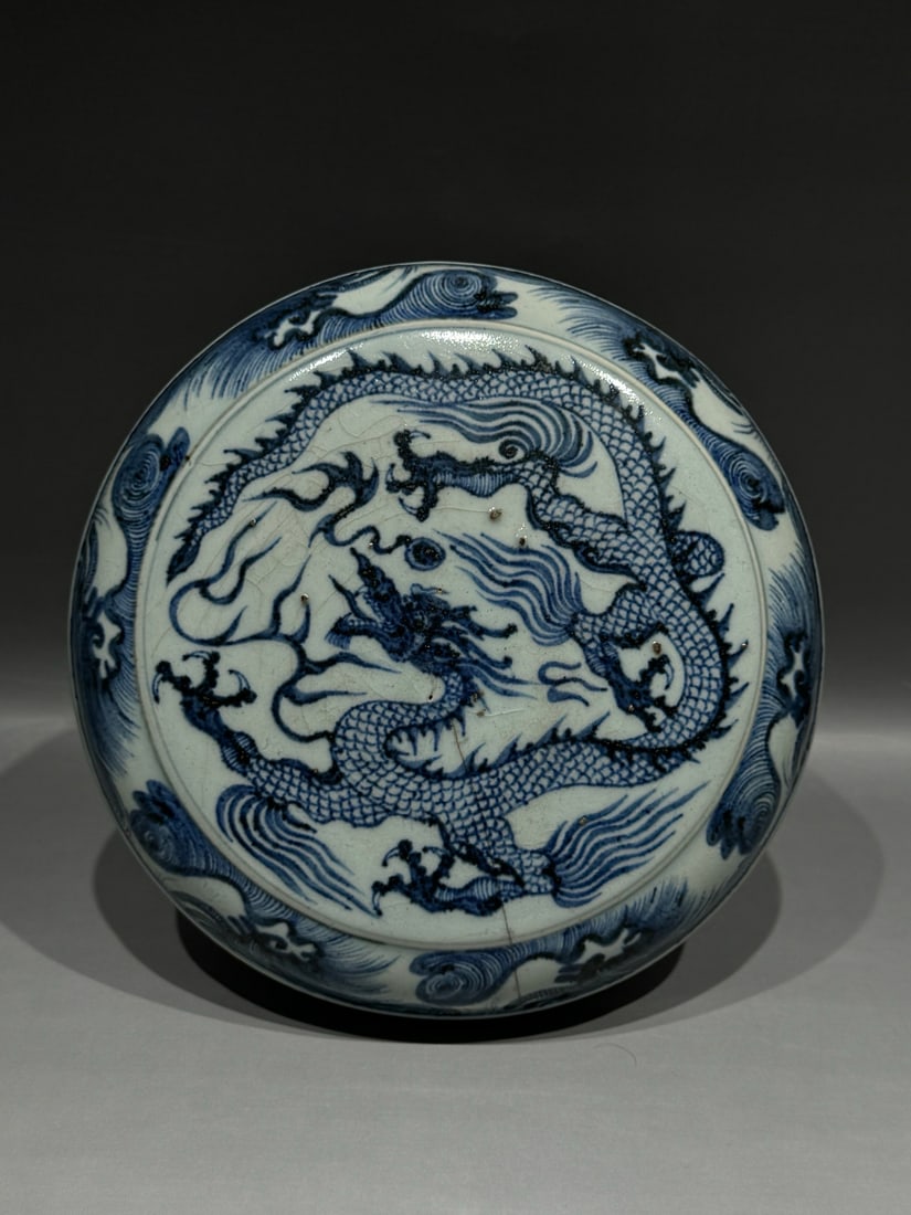 Yuan 14th C Blue and White Cloud Dragon Covered Box: Yuan Dynasty (1271–1368), 14th century, A blue and white covered box with cloud and dragon decoration, with minor firing lines and glaze flakes./ Mouth Diameter 20.5 cm / Height 11 cm/AI Authenticat