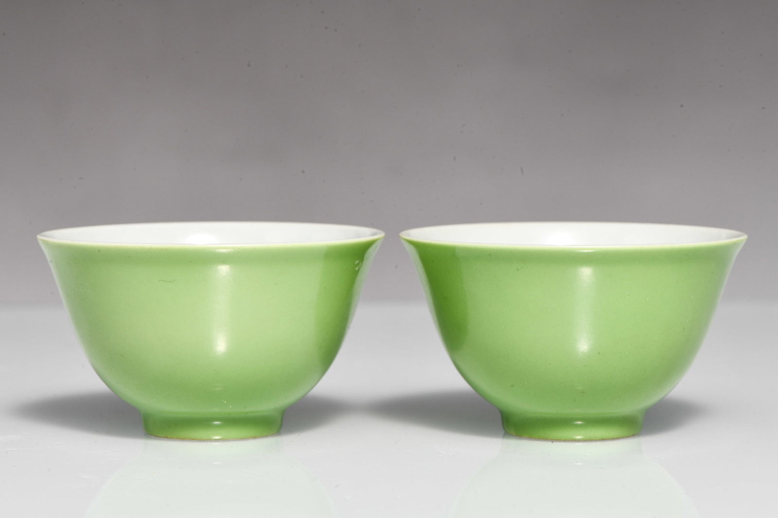 A pair of apple-green glazed cups (1 of 4)