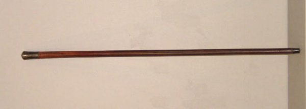 PRESENTATION GADGET CANE. Wooden shaft and a silver: PRESENTATION GADGET CANE. Wooden shaft and a silver plated handle engraved "To H.W. Glenny from the officers Oct. 28th, 1892". Inside the shaft is a syringe with a scalpel marked "Sheffield, England".