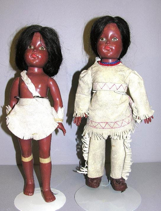 TWO COMPOSITION EFFANBEE HISTORICAL REPLICAS, 14".: TWO COMPOSITION EFFANBEE HISTORICAL REPLICAS, 14". Marked on back "EFFANBEE ANN SHIRLEY". Dark complexioned Native American Indians with painted eyes, human hair wigs, original leather clothing and he
