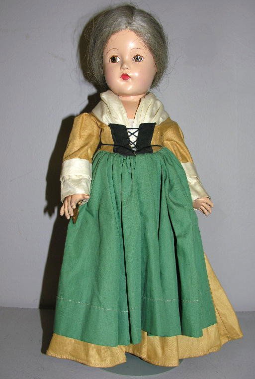 EFFANBEE HISTORICAL REPLICA PURITAN LADY, 15". Bac: EFFANBEE HISTORICAL REPLICA PURITAN LADY, 15". Back marked "Effanbee Ann Shirley", painted features, human hair wig, original clothes and heart bracelet. Note on doll: "Mother bought at Pogue's 1939"