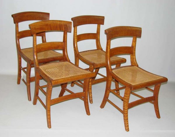 SET OF FOUR SIDE CHAIRS.: Good curl and color on saber leg side chairs with cane seats. Stamped "ITW" on inside front rail. Minor age splits due to curl and regluing. American. Early 19th Century. 17"h. seat. 32 3/4"h overall.