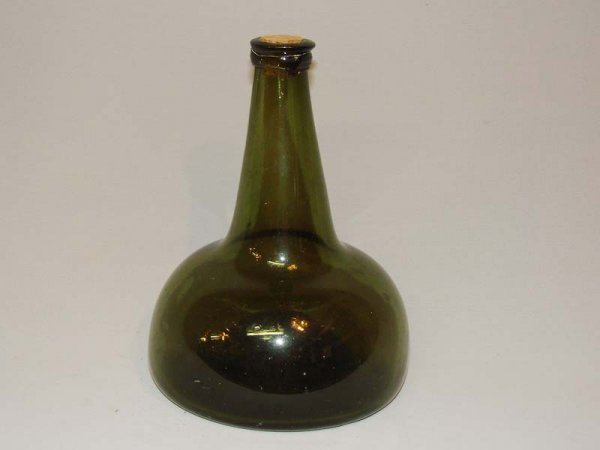OLIVE BLOWN GLASS BOTTLE. Early 18th Century. Squa