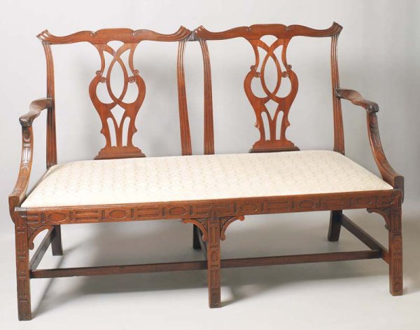 CARVED CHIPPENDALE SETTEE. English, 18th Century. 