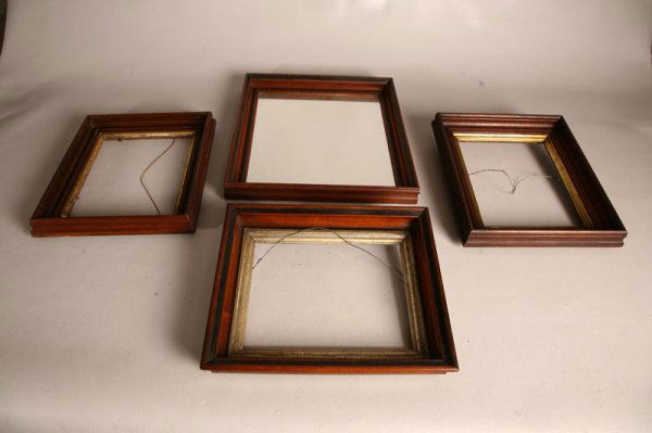 FOUR MID 19TH CENTURY FRAMES. Walnut. Three simila: FOUR MID 19TH CENTURY FRAMES. Walnut. Three similar deeply molded 13" x 11" frames with original gilt liners and older finish. And one similar but larger frame now fitted with a mirror. 16" x 14 1/2".