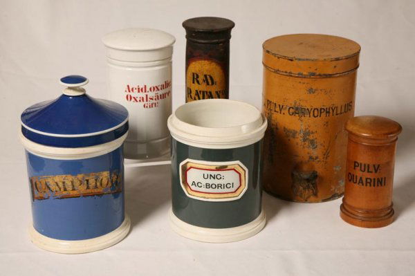 SIX MISCELLANEOUS APOTHECARY CONTAINERS.Two of wo: SIX MISCELLANEOUS APOTHECARY CONTAINERS.Two of wood, 6"h. 8"h. three ceramic (one without lid) 7"h., 7 1/2"h. and 9 1/2"h. One painted tin. 9 1/2"h.