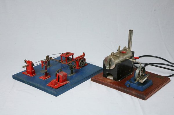 JENSEN STEAM DRIVEN MACHINIST SHOP. Six piece dior: JENSEN STEAM DRIVEN MACHINIST SHOP. Six piece diorama that includes table saw, drill press, and pulley system. 4.5" H, 11.5" L, 14" W. With electric power source marked "Style No. 5". 10" H, 9.5 L, 11