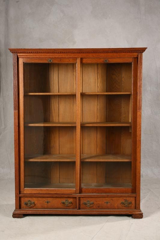 OAK BOOKCASE. Late 19th - early 20th century. Two