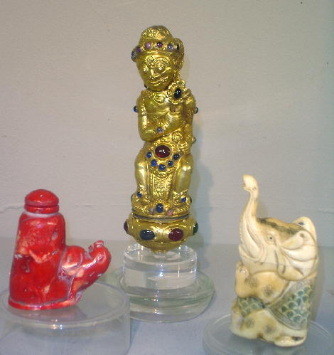 THREE PIECES: Indonesian figural gilt sword hilt se