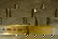 187: PAIR OF SMALL BRASS ANDIRONS AND A FENDER. Andiron
