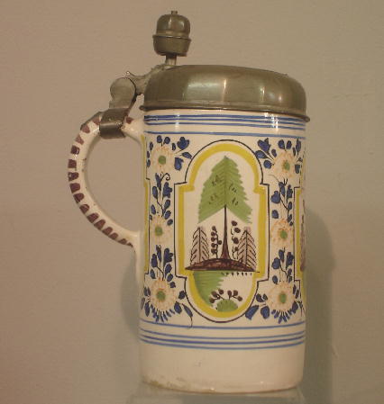 DELFT STEIN. Polychrome hand painted decoration on: DELFT STEIN. Polychrome hand painted decoration on tin glaze. Pewter lid with Continental touch marks and engraved "AM 1744". Acorn thumbpiece. Minor flakes and lid is a bit out of shape. 8 1/2"h.