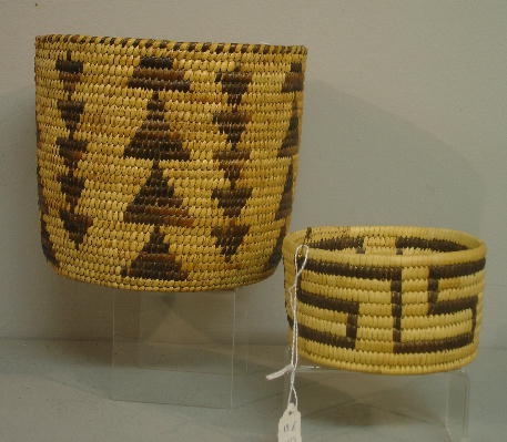 TWO PAPAGO INDIAN BASKETS. Both yucca with dark ma: TWO PAPAGO INDIAN BASKETS. Both yucca with dark martynia design. One a deep cylindrical basket with bands of triangle around sides. 7" d., 6" h. Other a small straight sided basket with a meandering f