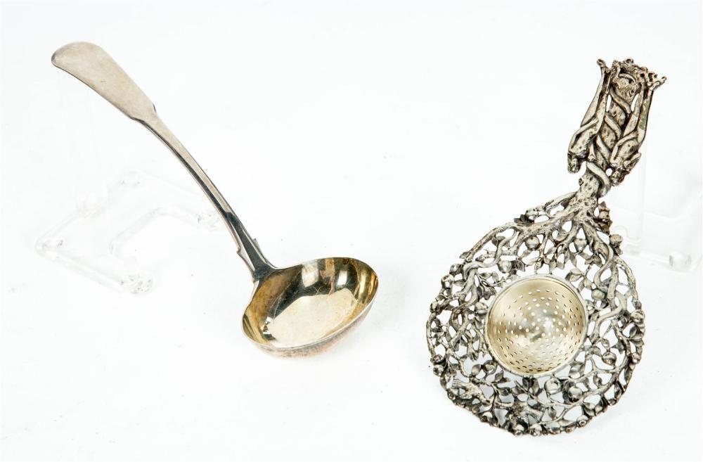 TWO PIECES OF STERLING.: TWO PIECES OF STERLING. Nineteenth century. An English fiddle back ladle dated 1808-09, and a tea strainer with tree of life with serpent and Adam and Eve.