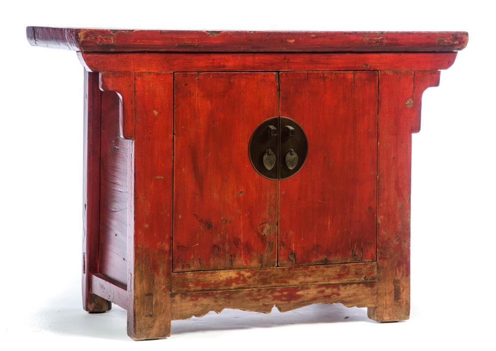 CHINESE LACQUERED CABINET.: CHINESE LACQUERED CABINET. Late 19th century, elm. Mortised construction with enhanced red lacquer. Two doors with brass moon hardware. Edge wear and minor loss. 28"h. 36"w. 18.5"d.