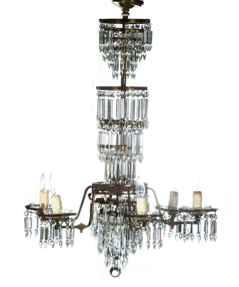 SIX-LIGHT GAS CHANDELIER WITH PRISMS.: SIX-LIGHT GAS CHANDELIER WITH PRISMS. American, 4th quarter-19th century. Brass with eleven tiers of spear point cut prisms, 36"h. 28" diameter.