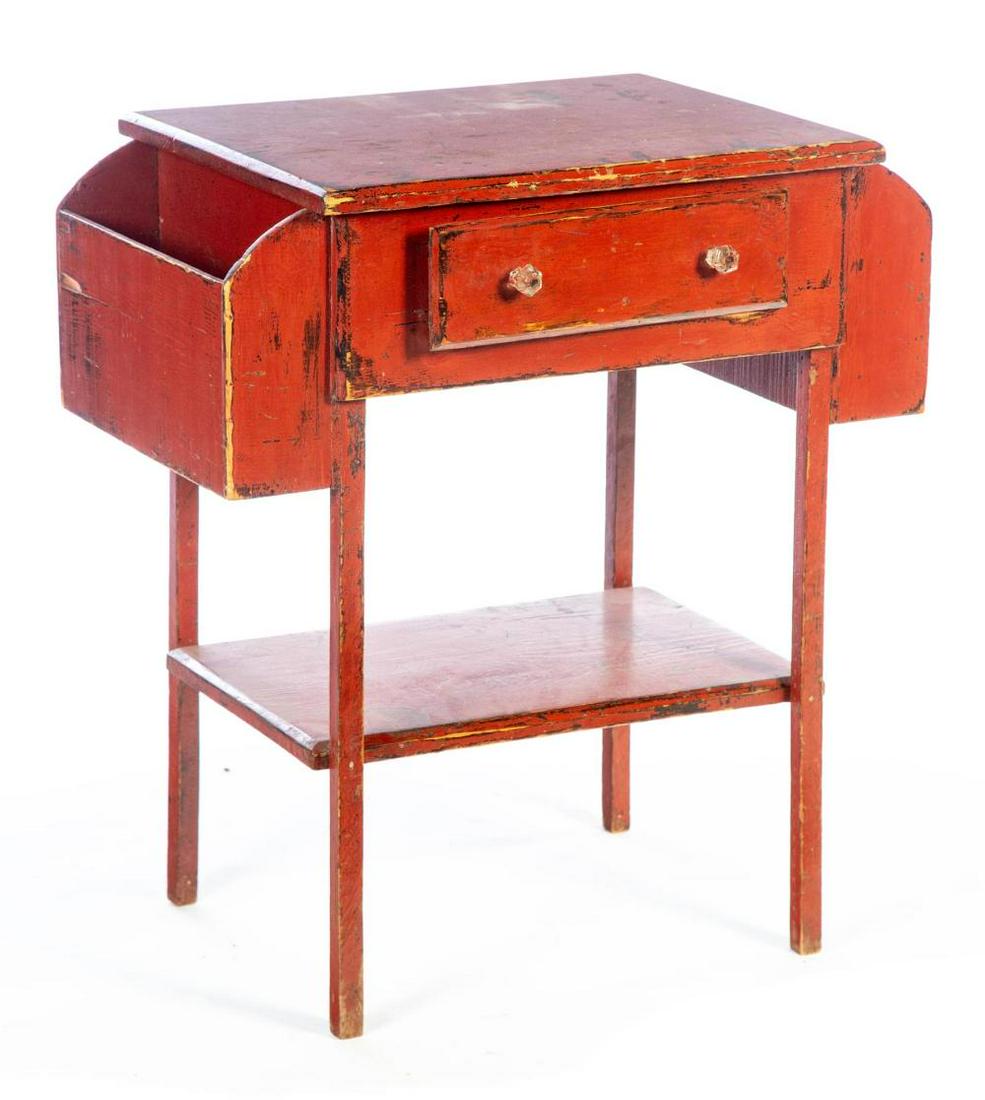 PAINTED MAKE DO ONE-DRAWER STAND.: PAINTED MAKE DO ONE-DRAWER STAND. America, 20th century, pine. Fruit crate drawer bottom, magazine pockets, lower shelf, and rust red paint. 29"h. 27"w. 16.5"d.